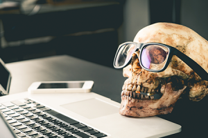 skull with glasses on a desk for halloween