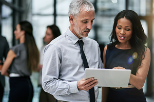 Two people discussing The Adecco Group GTCI report