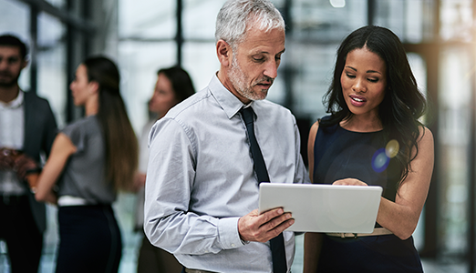 Two people discussing The Adecco Group GTCI report